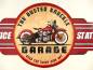 Preview: kreis mit rotem Motorrad  und unterschrift Garage