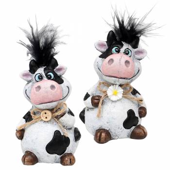 zwei lustige schwarz-weiße Kühe lächelnd mit strubbeligem Haar