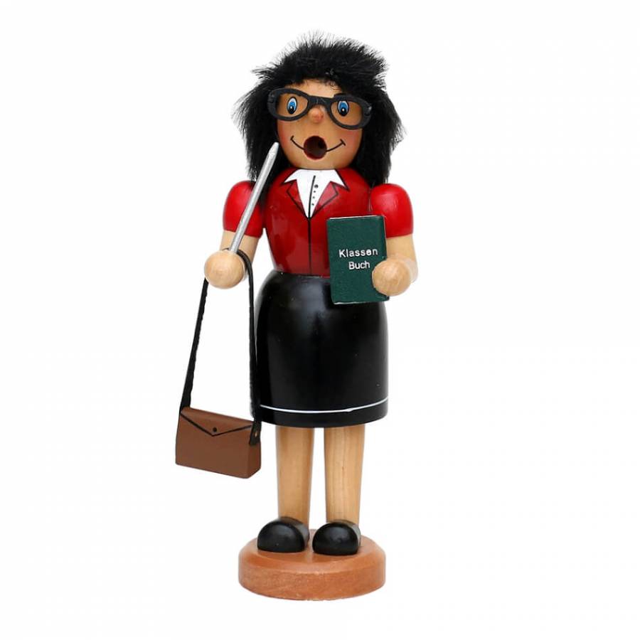 Räucherfigur raeuchermaennchen Räucherfrau Lehrerin mit roter Jacke, schwarzem Rock und schwarzem Kunsthaar. in der einen Hand ihre Handtasche und in der anderen das grüne Klassenbuch