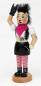 Preview: Räucherfigur Räucherfrau Punker Lady mit hochstehenden schwarzen Haaren, rosa Halstuch Weste und Minirock. Im Mund eine Zigarette
